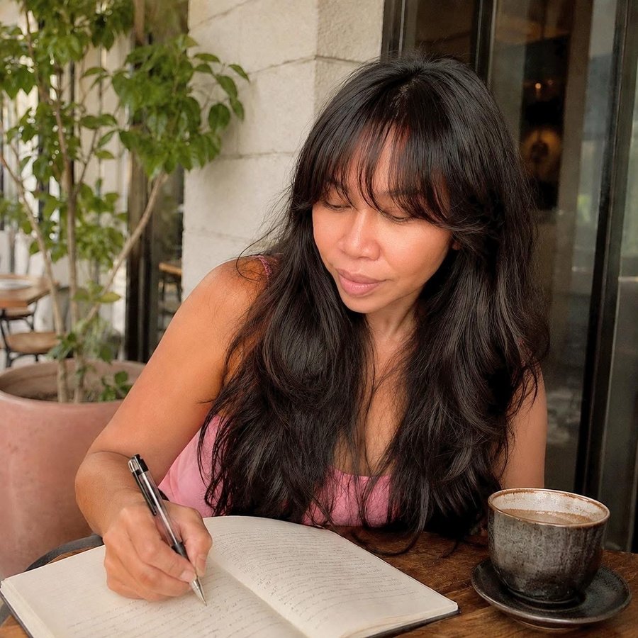 Odette journaling — one of her daily self-care rituals